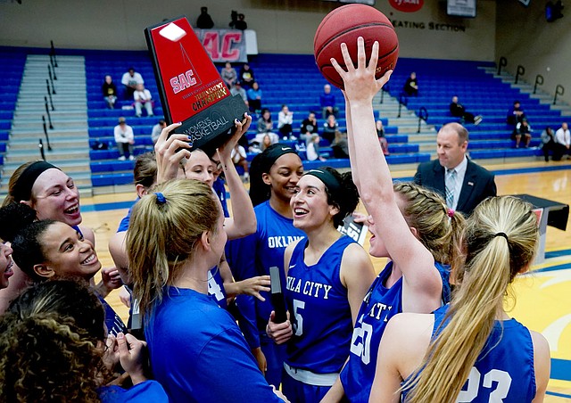 Matthew Christensen/JBU Sports Information Oklahoma City women's basketball players celebrate after winning the Sooner Athletic Conference Tournament on Saturday at Bill George Arena. The defending national champion Stars defeated Science and Arts 89-63.
