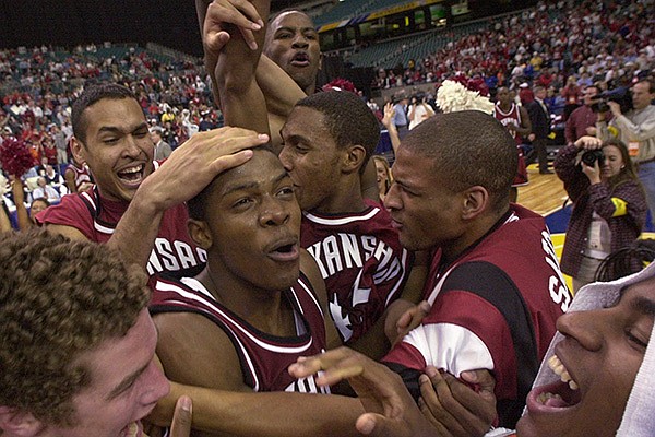 From left Arkansas' Blake Eddins, Dionisio Gomez, Joe Johnson, Brandon Dean, Carl Baker, Larry Satchell and Chris Walker celebrate on the court after beating Auburn 75-67 Sunday, March 12, 2000 in the championship game of the Southeastern Conference Tournament at the Georgia Dome in Atlanta. (AP Photo/Dave Martin)