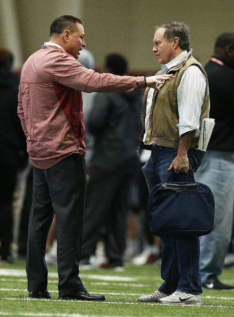New England Patriots Coach Bill Belichick (right) and former Tennessee coach Butch Jones (left) were among the spectators at Alabama’s pro day Wednesday in Tuscaloosa, Ala. Jones is going through a hiring process to be hired as an analyst at Alabama. 