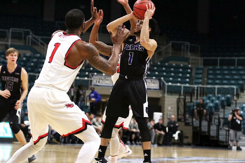 Central Arkansas guard Jordan Howard (right) had a game-high 26 points Wednesday to lead the Bears to a 67-57 victory over Lamar at the Southland Conference Tournament in Katy, Texas. UCA, which earned its first-ever tournament victory, advances to play No. 3 seed Stephen F. Austin at 7:30 p.m. today. 