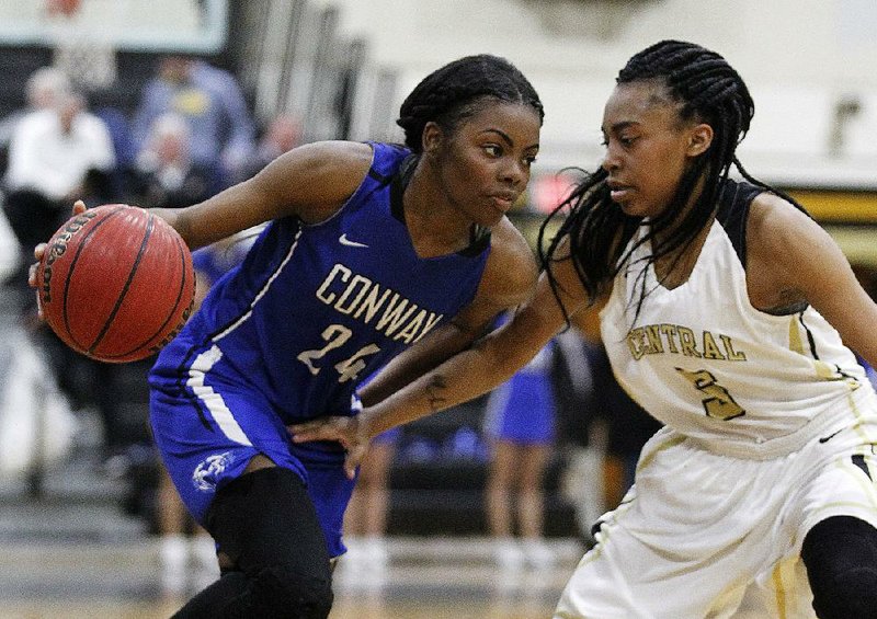 Conway junior guards Asiyha Smith (24) and Myla Yelder have been teammates since the second grade and know each other well. Coach Ashley Nance said Smith is “very hard-nosed and toughskinned,” while Yelder is “a pleaser and wants everyone to be happy with her.” 