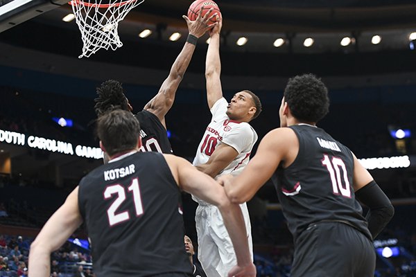 Arkansas center Daniel Gafford shoots over South Carolina forward Chris Silva during a Southeastern Conference Tournament game on Thursday, March 8, 2018, in St. Louis. 