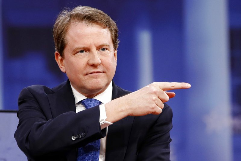 In this Feb. 22, 2018, file photo, White House counsel Don McGahn gestures while speaking at the Conservative Political Action Conference (CPAC), at National Harbor, Md. As a candidate, Donald Trump pledged to drain the swamp in Washington. But as president, records show he and his appointees have stocked federal agencies with ex-lobbyists and corporate lawyers who now help regulate they very industries rom which they collected paychecks. Records reviewed by The Associated Press show McGahn, has issued at least 24 ethics waivers to key administration officials at the White House and executive branch agencies. (AP Photo/Jacquelyn Martin, File)