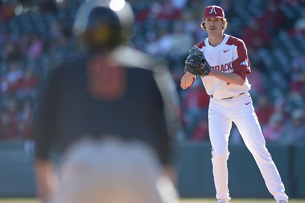 Arkansas pitcher Blaine Knight looks at a Southern Cal base runner during a game Friday, March 2, 2018, in Fayetteville. 