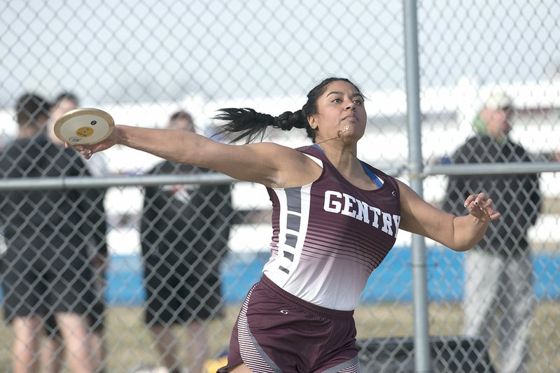 NWA Democrat-Gazette/J.T. WAMPLER Chastery Fuamatu of Gentry throws the discus Thursday during the Joe Roberts Relays at Har-Ber High School in Springdale.