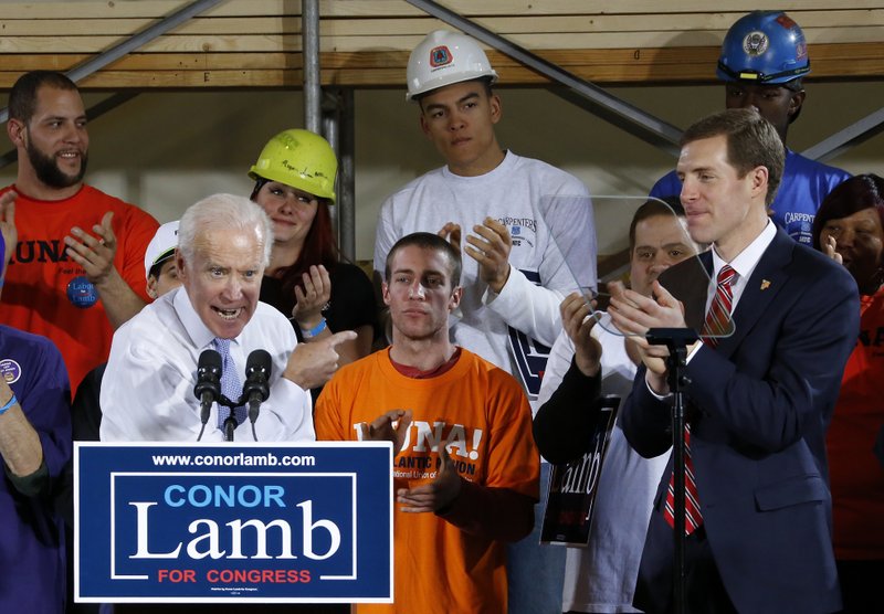 In this March 6, 2018, photo, former Vice President Joe Biden points at Conor Lamb, right, the Democratic candidate for the March 13 special election in Pennsylvania's 18th Congressional District, during a rally at the Carpenter's Training Center in Collier, Pa. Fighting to stave off another special election embarrassment, the White House is strengthening its final-days offensive in western Pennsylvania. (AP Photo/Gene J. Puskar)