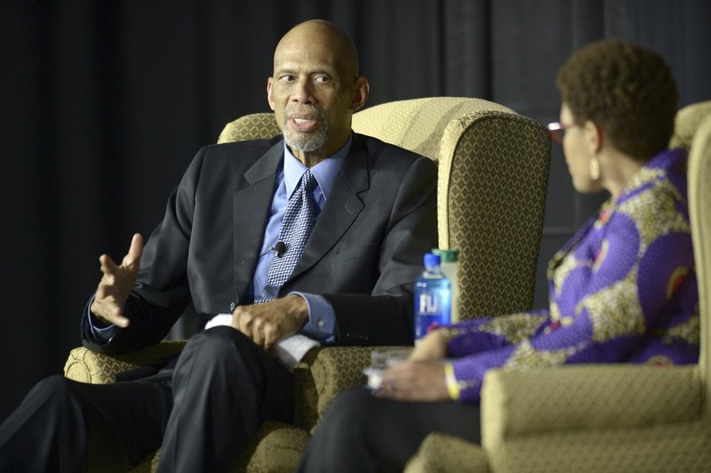 Kareem Abdul-Jabbar speaks Thursday alongside moderator Pearl Dowe, associate professor of political science at the University of Arkansas, in Bud Walton Arena in Fayetteville.