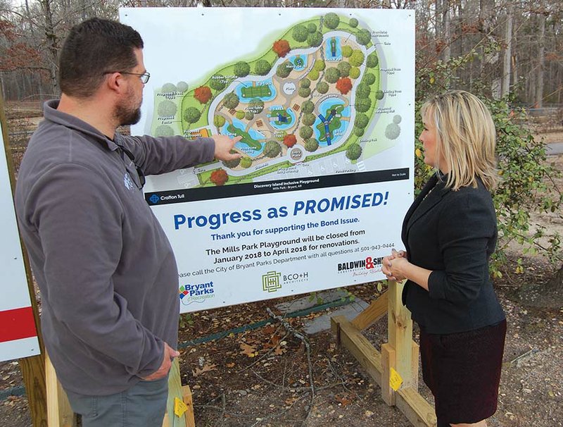 Parks and Recreation Director Chris Treat, left, and Mayor Jill Dabbs discuss some of the 
amenities that will be added to the new inclusive Mills Park in Bryant.
