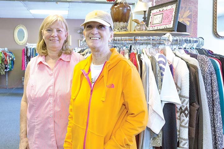 Janet Wilson, left, and Bonnie Johnson stand in the new Helping Hands & Caring Hearts Thrift Store in Jacksonville at 515 S. James St.