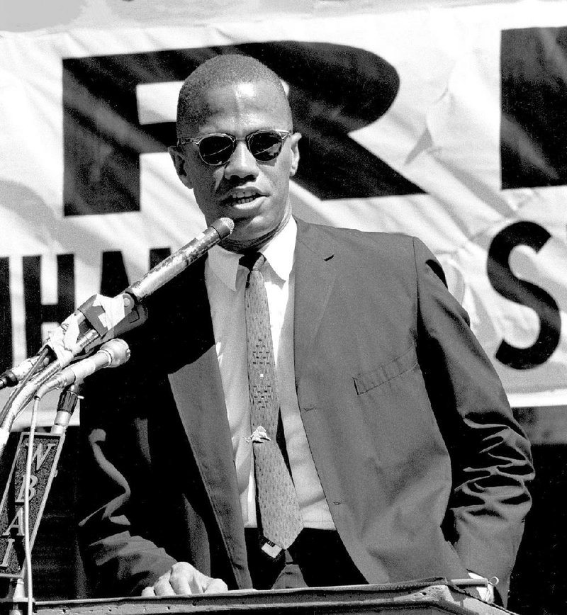 Malcom X in Harlem is the title of this 1963 photograph by Adger Cowans. It is part of “Personal Vision: The Exhibition” at Hearne Fine Art.