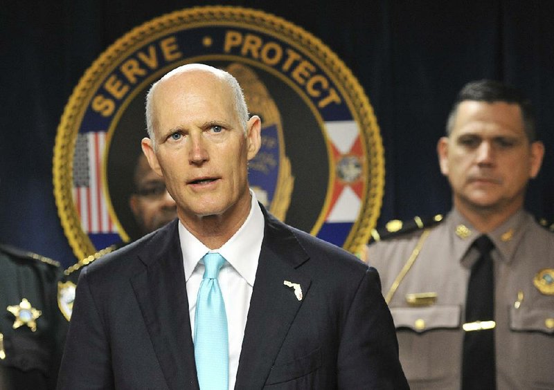 Florida Gov. Rick Scott has yet to say whether he will sign the gun-control bill delivered to him Thursday.