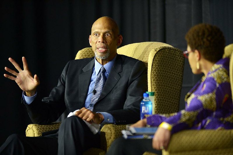 Kareem Abdul-Jabbar shares the stage Thursday with moderator Pearl Dowe at the University of Arkansas, Fayetteville’s Bud Walton Arena.