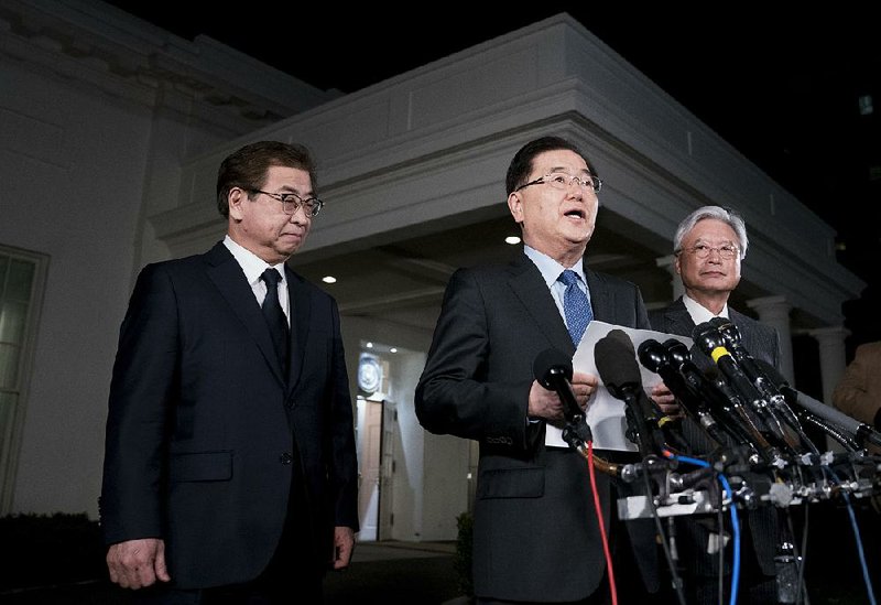 Chung Eui-yong (center), South Korea’s national security director, accompanied by intelligence chief Suh Hoon (left), said Thursday evening outside the White House that President Donald Trump’s “maximum pressure” economic campaign against North Korea helped create a diplomatic opening with the North after years of escalating tensions.