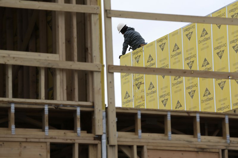 FILE- In this Monday, Feb. 26, 2018, photo, work continues on a new development in Fair Lawn, N.J. On Friday, March 9, the Labor Department reported that U.S. employers added 313,000 jobs in February, the most in any month since July 2016, and drawing hundreds of thousands of people into the job market. (AP Photo/Seth Wenig, File)