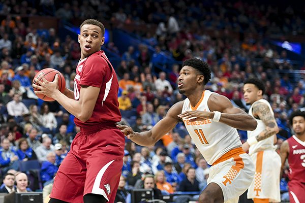 Arkansas' Daniel Gafford (10) turns against Tennessee's Kyle Alexander (11) during an SEC Tournament game Saturday, March 10, 2018, in St. Louis. 