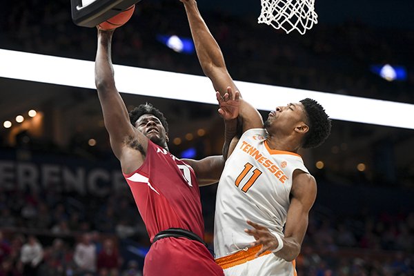 Arkansas guard Jaylen Barford (0) goes up for a layup against Tennessee forward Kyle Alexander (11) during an SEC Tournament game Saturday, March 10, 2018, in St. Louis. 