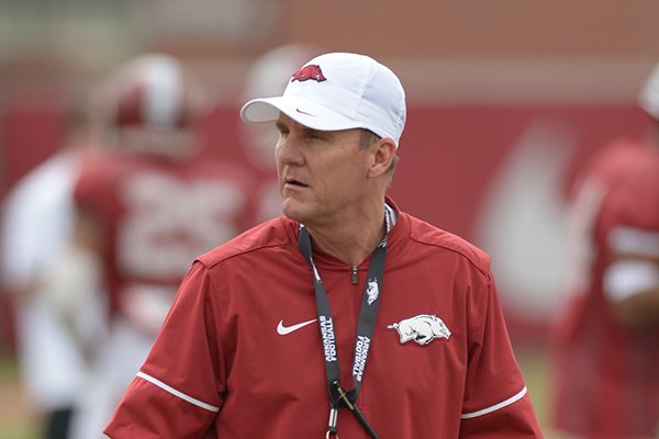 Arkansas coach Chad Morris watches his players Saturday, March 10, 2018, during practice at the university practice field in Fayetteville.