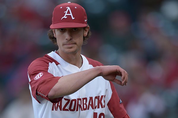 Arkansas starter Blaine Knight returns to the dugout after recording the third Kent State out Friday, March 9, 2018, during the sixth inning at Baum Stadium in Fayetteville.