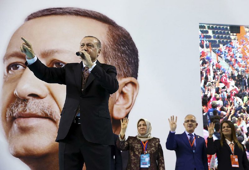 Turkish President Recep Tayyip Erdogan speaks at a rally Saturday in Mersin in southern Turkey. Erdogan criticized NATO for not supporting his military offensive in Syria, accusing it of double standards.