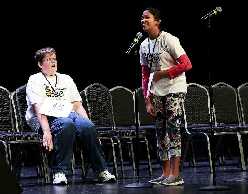 FILE — Jonah Patton (left), 12, of Knoxville and Pavani Chittemsetty (right), 11, of Bentonville react as Chittemsetty correctly spells "laterigrade" to win the 2018 Arkansas State Spelling Bee on Saturday, March 10, 2018, at the Harold E. Cooper Education Complex at Central Baptist College in Conway. As winner, Chittemsetty, a sixth grader at Northwest Arkansas Classical Academy won an all-expenses-paid trip to Washington D.C. to compete in the Scripps National Spelling Bee as well as other prizes. Patton was runner-up. 

Arkansas Democrat-Gazette/THOMAS METTHE -- 3/10/2018 