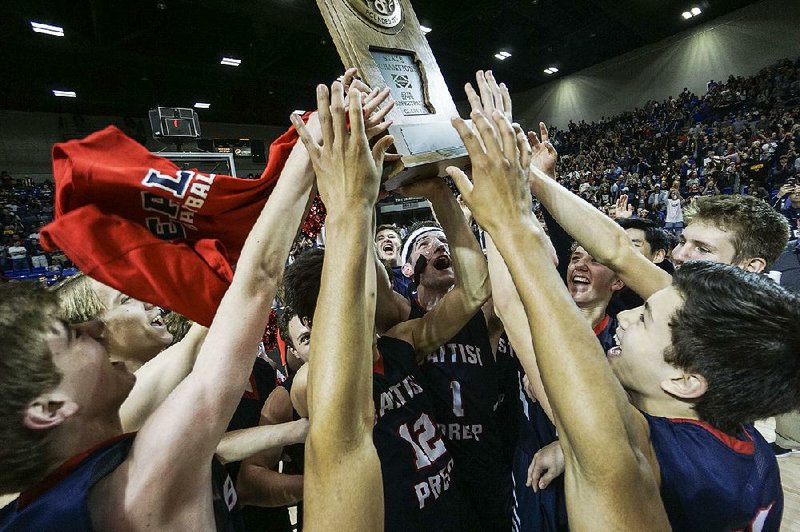 Baptist Prep celebrates after winning the boys Class 4A state championship Saturday at Bank of the Ozarks Arena in Hot Springs. It was the sixth state title for the Eagles.