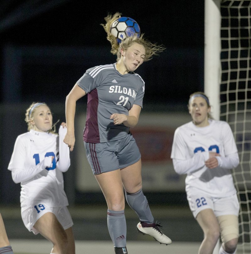 Ben Goff/NWA Democrat-Gazette Hailey Dorsey of Siloam Springs heads the ball off a corner kick Tuesday during the match against Rogers at Whitey Smith Stadium in Rogers.