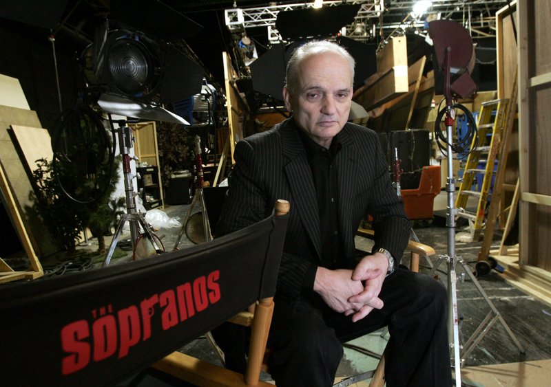 FILE - In this March 3, 2006 file photo, David Chase, creator and producer of the hit HBO series "The Sopranos," poses on a set in the Queens borough of New York. Warner Bros. Pictures says Thursday that New Line has purchased a screenplay for a 'Sopranos' prequel from series creator David Chase and Lawrence Konner. The studio says the working title is 'The Many Saints of Newark' and will be set in the 1960s during the Newark riots. Chase's acclaimed series about the mobster Tony Soprano played by the late James Gandolfini ran for six seasons on HBO and won 21 primetime Emmys. (AP Photo/Diane Bondareff, File)