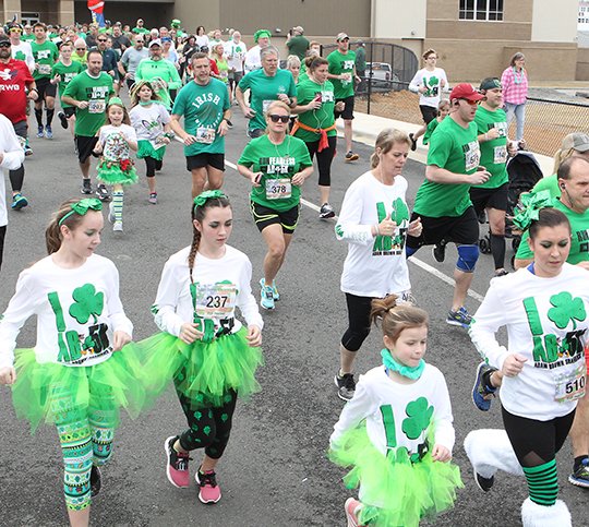 Participants take off from the start of the Adam Brown Shamrock Run 5K at Lake Hamilton School Saturday, March 10, 2018. In its 8th year, the event drew over 1000 participants. The proceeds raised will go to the Adam Brown Lagacy Fund which assists local individuals and charitable organizations. (The Sentinel-Record/Richard Rasmussen)