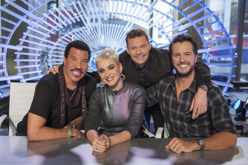 This image released by ABC shows, from left, Lionel Richie, Katy Perry, Ryan Seacrest and Luke Bryan in New York. Richie, Perry and Bryan are the judges on the next season of &quot;American Idol,&quot; premiering March 11 on ABC. (Eric Liebowitz/ABC via AP)