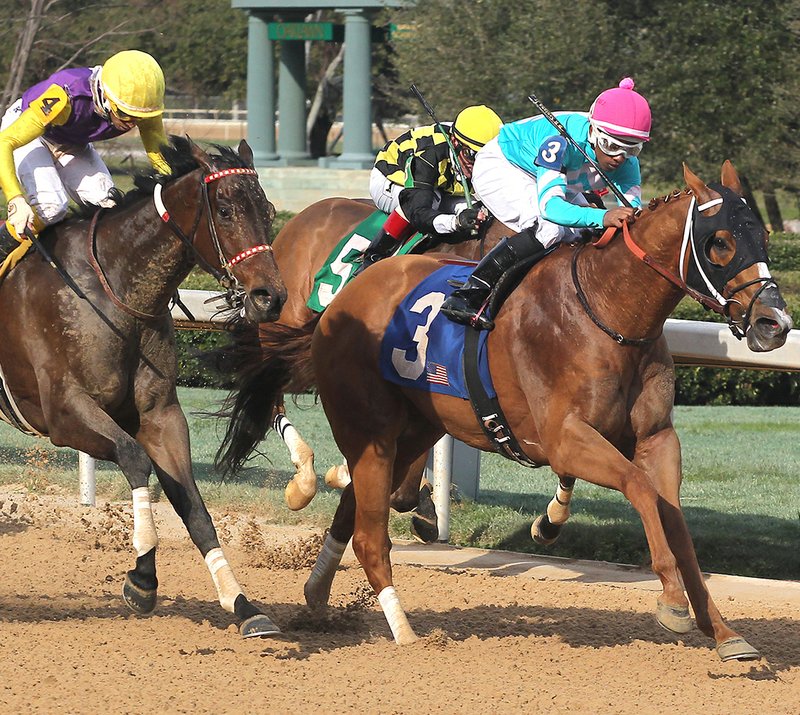 The Sentinel-Record/Richard Rasmussen SPA CITY SPECIAL: Jockey Ricardo Santana Jr., guides Whitmore (3), right, across the wire ahead of Wynn Tyme (4) and jockey Ramon Vazquez, left, to win the $125,000 Hot Springs Stakes at Oaklawn Park Saturday. Ivan Fallunovalot (5) finished third.
