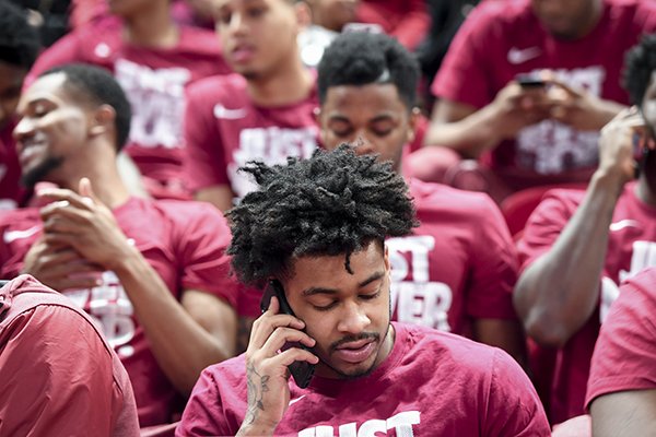 Arkansas guard Anton Beard, front, and other players sit at an NCAA Tournament selection show watch party Sunday, March 11, 2018, in Fayetteville. 