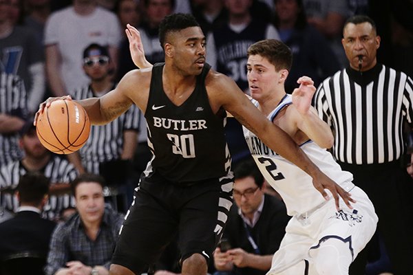 Villanova's Collin Gillespie (2) defends Butler's Kelan Martin (30) during the first half of an NCAA college basketball game in the Big East men's tournament semifinals Friday, March 9, 2018, in New York. (AP Photo/Frank Franklin II)


