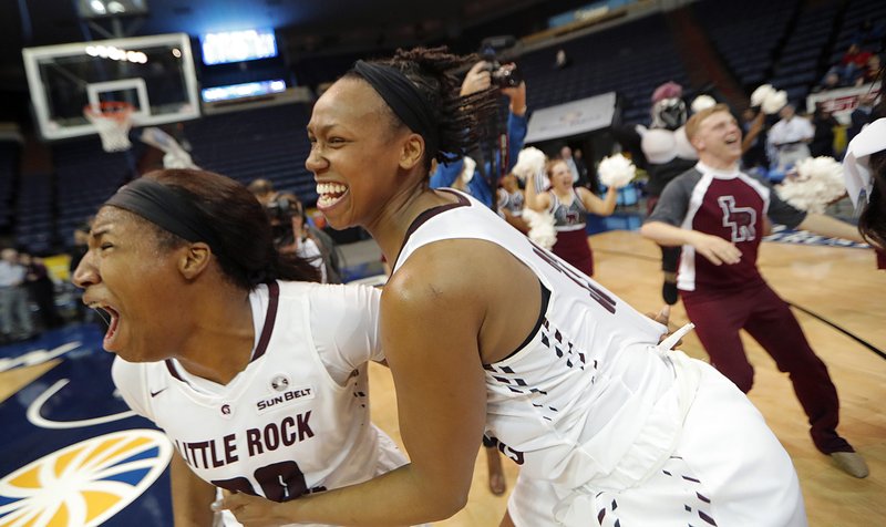 UALR forward Ronjanae DeGray, left, and forward Keanna Keys celebrate their victory over Texas State in the Sun Belt Conference NCAA college basketball championship game in New Orleans, Sunday, March 11, 2018. UALR won 54-53. (AP Photo/Gerald Herbert)

