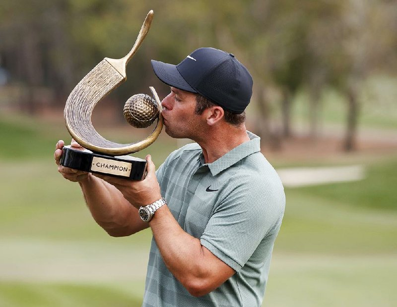 Paul Casey kisses the winner’s trophy after winning the Valspar Championship on Sunday in Palm Harbor, Fla. He finished with a 10-under 274, giving him his second PGA Tour title and his first since the Houston Open in 2009.AP/MIKE CARLSON