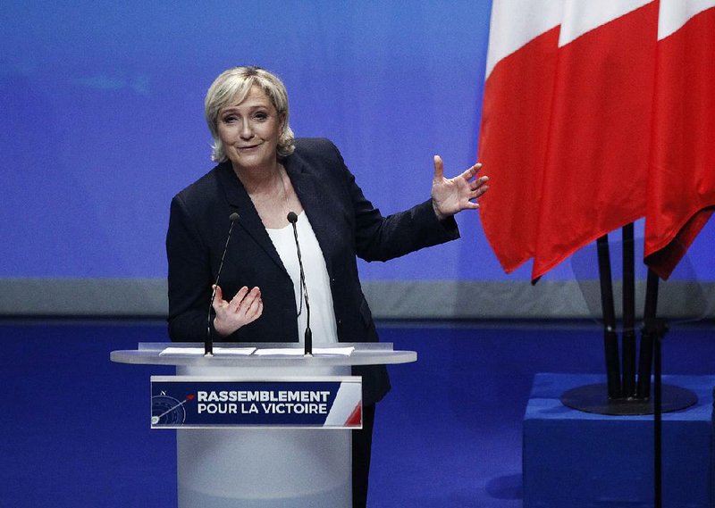 Marine Le Pen addresses the National Front party congress in Lille, northern France, on Sunday. Le Pen, whose father co-founded the party, plans to propose changing the party’s name to the National Rally.