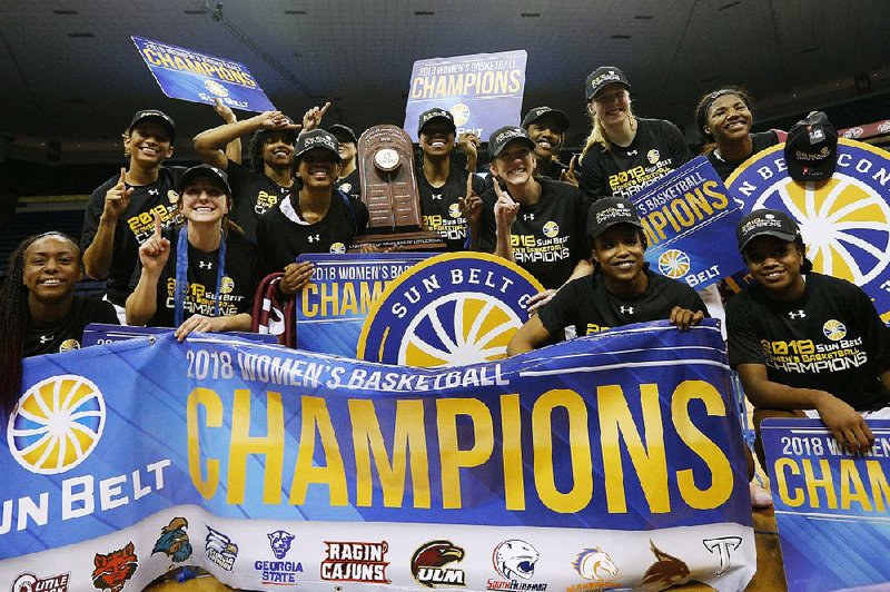 UALR celebrates after defeating Texas State 54-53 on Sunday in the championship of the Sun Belt Tournament against Texas State in New Orleans.