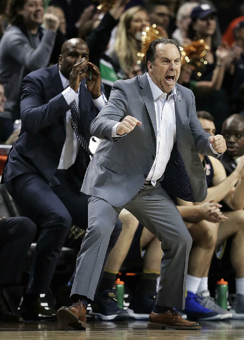 Notre Dame Coach Mike Brey reacts during the second half of his team’s victory over Virginia Tech in the second round of the Atlantic Coast Conference tournament Wednesday in New York. Notre Dame won 71-65. The Irish will be a top seed in the National Invitation Tournament.