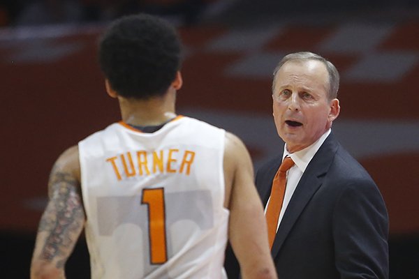 Tennessee coach Rick Barnes talks with guard Lamonte Turner (1) during the first half of the team's NCAA college basketball game against Florida on Wednesday, Feb. 21, 2018, in Knoxville, Tenn. (AP Photo/Crystal LoGiudice)
