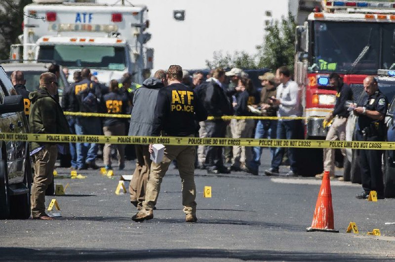 Authorities investigate an explosion at a home in Austin, Texas, on Monday.