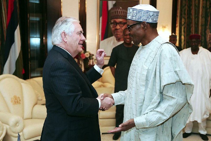 U.S. Secretary of State Rex Tillerson is welcomed by Nigerian President Muhammadu Buhari at the Presidential Villa in Abuja, Nigeria, on Monday.
