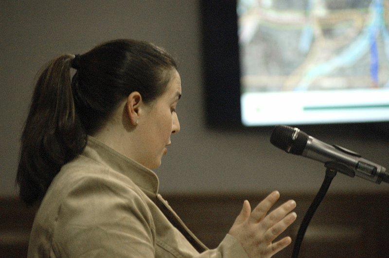 NWA Democrat-Gazette/STACY RYBURN Nicole Claesen speaks Monday during a Fayetteville Planning Commission meeting. Several residents spoke during a proposed change to the city's street plan that includes Rolling Hills Drive.
