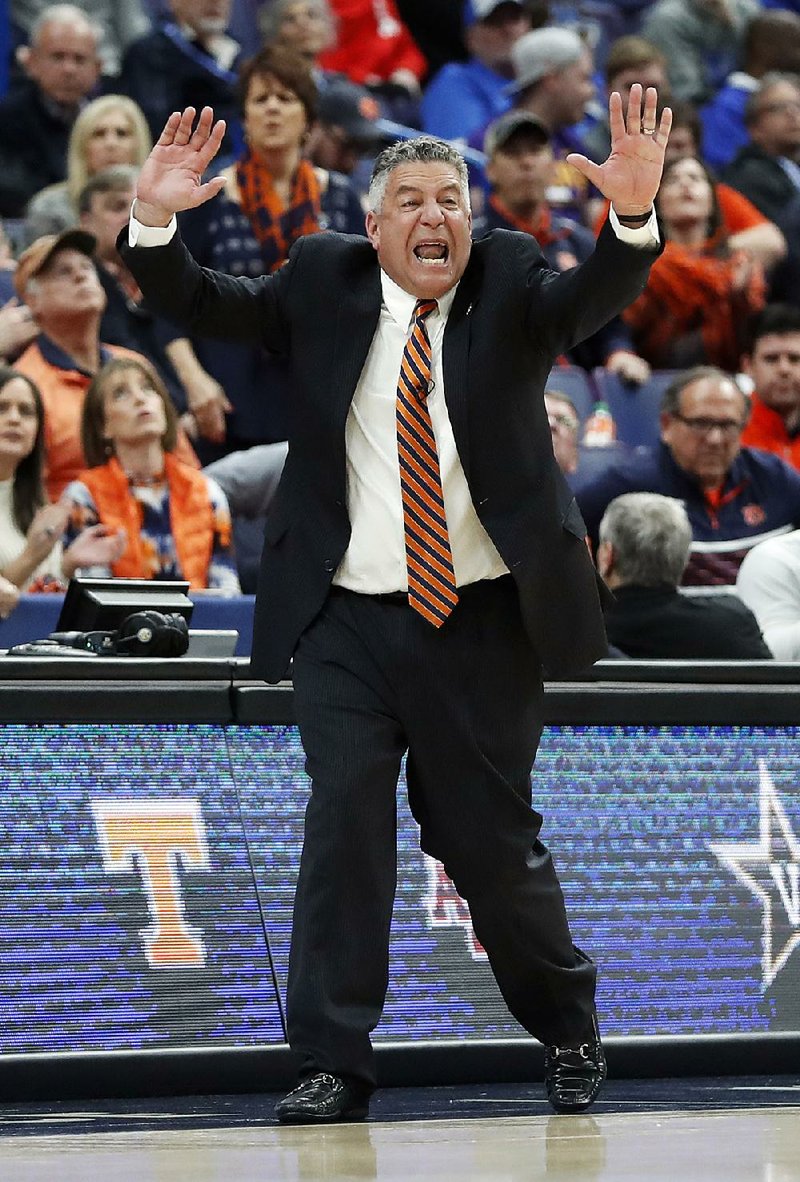 Auburn head coach Bruce Pearl yells from the sidelines during the first half in an NCAA college basketball quarterfinal game against Alabama at the Southeastern Conference tournament Friday, March 9, 2018, in St. Louis. (AP Photo/Jeff Roberson)