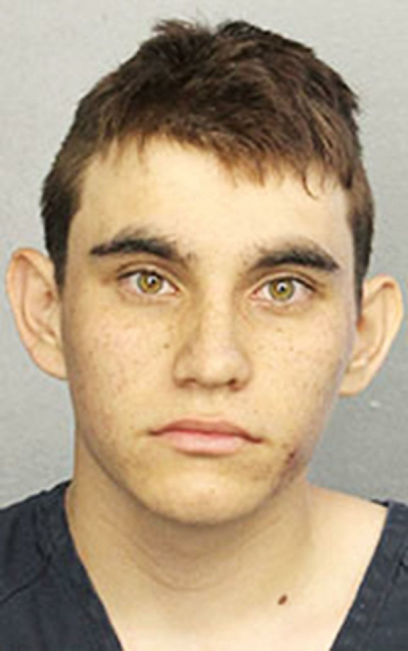 This photo provided by the Broward County Jail shows Nikolas Cruz.  Authorities say Cruz, a former student opened fire at Marjory Stoneman Douglas High School in Parkland, Fla., Wednesday,  Feb. 14, 2018, killing more than a dozen people and injuring several.  (Broward County Jail via AP)