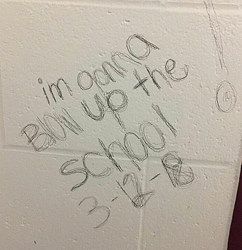 COURTESY PHOTO This photo shows the bomb threat written on a stall in the girls' bathroom at Lynch Middle School.