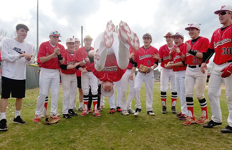 Submitted photo/Farmington freshman Kale Purifoy does a back-flip to get the baseball team ready to play against Springdale Friday. The feat has become a tradition for the Cardinals during pre-game preparations. After wins over Siloam Springs (17-3) and Shiloh Christian (2-1) last week, the Cardinals were beaten 7-4 by Springdale on Friday.