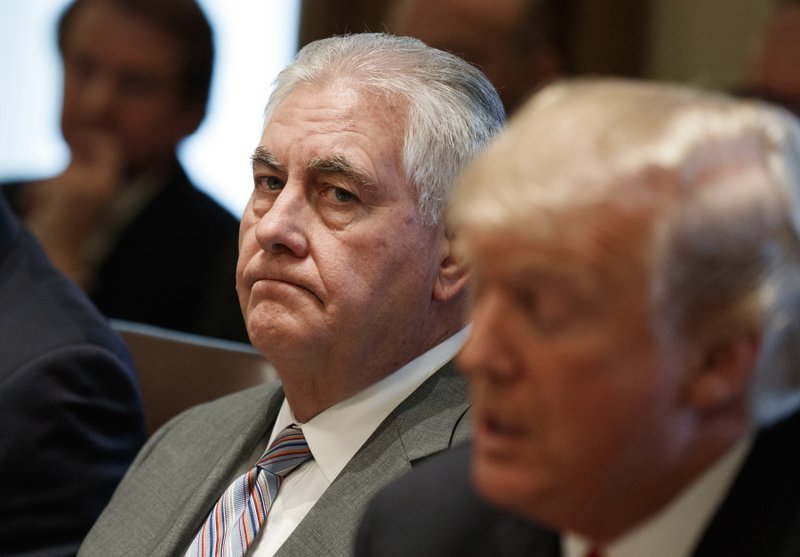 FILE - In this Jan. 10, 2018 file photo, Secretary of State Rex Tillerson listens as President Donald Trump speaks during a cabinet meeting at the White House in Washington. Tillerson is out as secretary of state. President Trump tweeted this morning that he's naming CIA director Mike Pompeo to replace him. (AP Photo/Evan Vucci)