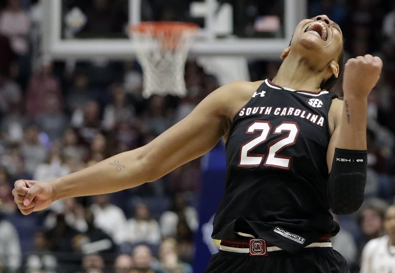 In this March 4, 2018, file photo, South Carolina forward A'ja Wilson celebrates after her team defeated Mississippi State in an NCAA college basketball championship game at the women's Southeastern Conference tournamen, in Nashville, Tenn.