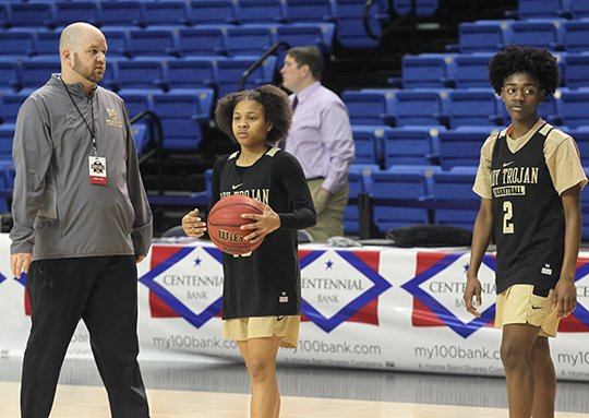 The Sentinel-Record/Richard Rasmussen ALL-STATE DUO: Hot Springs girls' basketball coach Josh Smith, left, works with senior Lady Trojan guards Ariana Guinn, center, and Imani Honey Friday at Bank of the Ozarks Arena before their Class 5A state championship victory over Watson Chapel on Saturday.