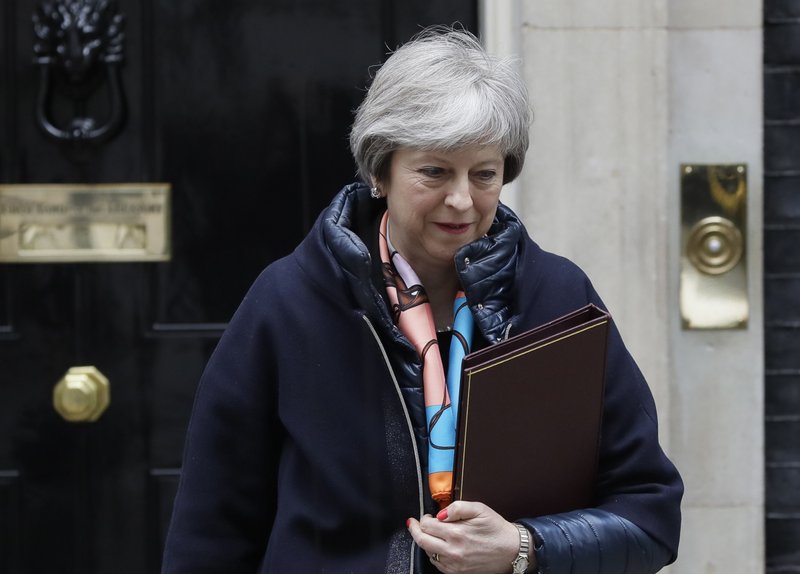 Britain's Prime Minister Theresa May leaves Downing Street to attend parliament for the Chancellors Spring Statement, in London, Tuesday, March 13, 2018. May said on Monday that Russian ex-spy Sergei Skripal and his daughter had been poisoned with Novichok, a military-grade nerve agent of a type developed in the Soviet Union near the end of the Cold War. (AP Photo/Kirsty Wigglesworth)