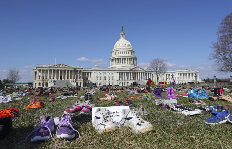 7000 pairs of shoes, one for every child killed by gun violence since the Sandy Hook school shooting, were placed on the Capitol lawn by Avaaz, a U.S.-based civic organization, on Capitol Hill in Washington, Tuesday, March 13, 2018. 